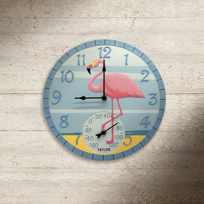 Front view of a 14 inch Flamingo Clock with Thermometer featuring a pink flamingo on blue striped background