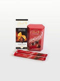 Lindt chocolate gift set with Lindor milk chocolate box, orange dark chocolate bar, and Lindor chocolate sticks. Perfect gift idea.