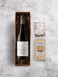 De-alcoholised red wine with macadamia nougat and nuts, a delightful pairing for enhanced flavors on the palate.