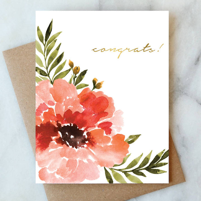 Anemone Congrats greeting card with watercolor floral design and kraft envelope on marble background