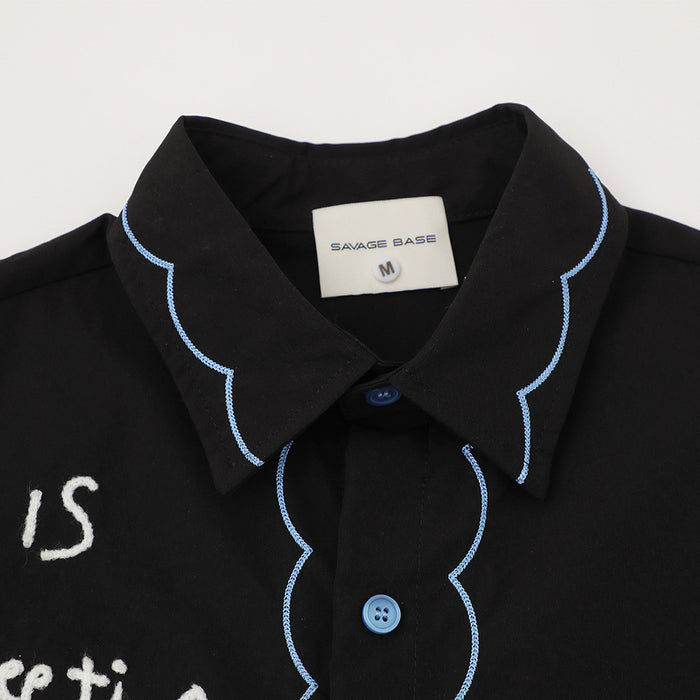 Black short sleeve shirt with light blue scalloped embroidery, button front, and oversized casual streetwear style