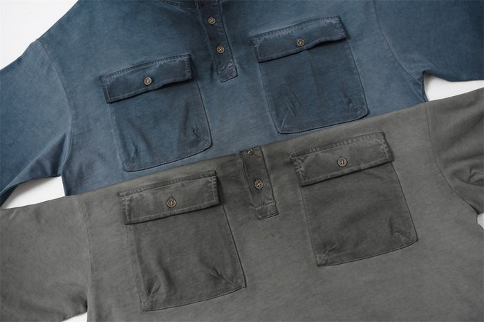 Oversized acid wash henley T-shirt in blue and gray with dual button chest pockets