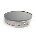 Electric crepe maker with gray cooking surface and control panel on a white background