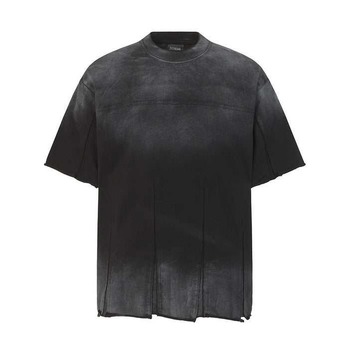 Black acid wash oversized T-shirt with faded texture, raw hem, and distressed streetwear style on a white background