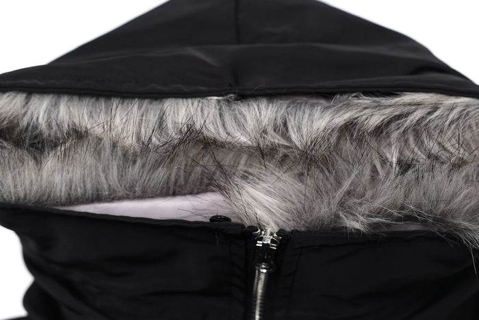 Close-up of black hood lining with gray faux fur trim and zipper