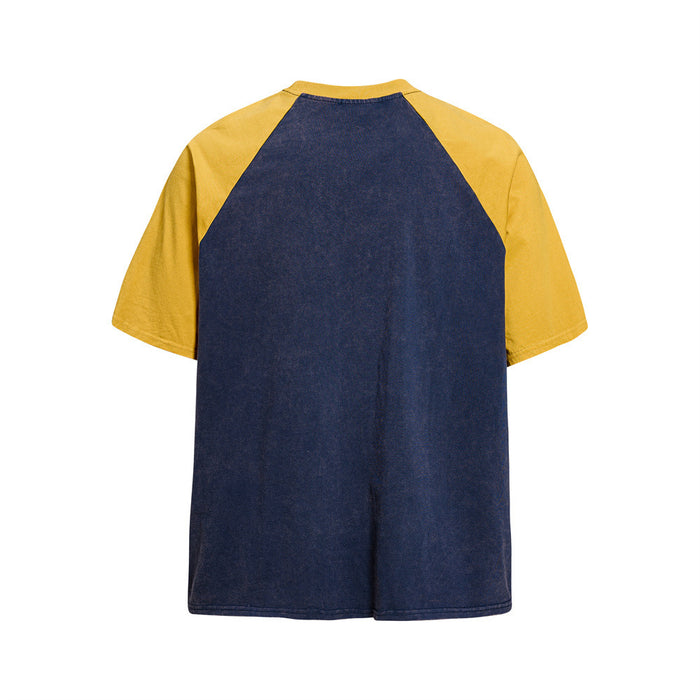 Vintage colorblock raglan T-shirt with navy body and mustard yellow sleeves, shown from the back on a white background
