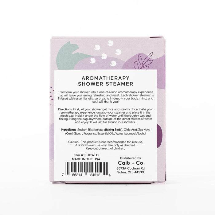 Aromatherapy shower steamer product packaging with ingredients, directions, and caution information displayed