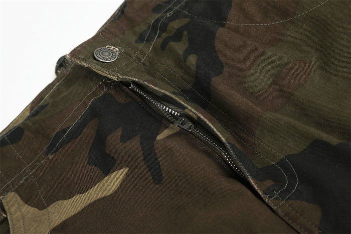 Close-up of camo cargo pants front fly with zipper detail