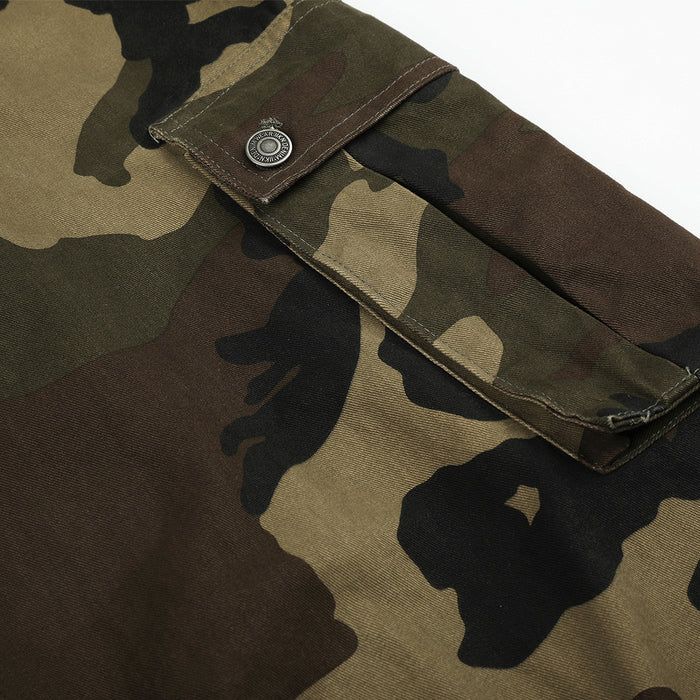Close-up of camo cargo pants side cargo pocket flap with snap button