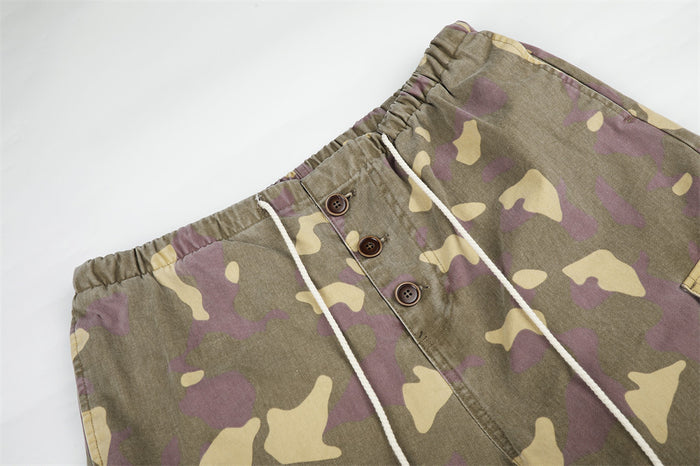 Close-up of drawstring waist and button fly on camo cargo pants