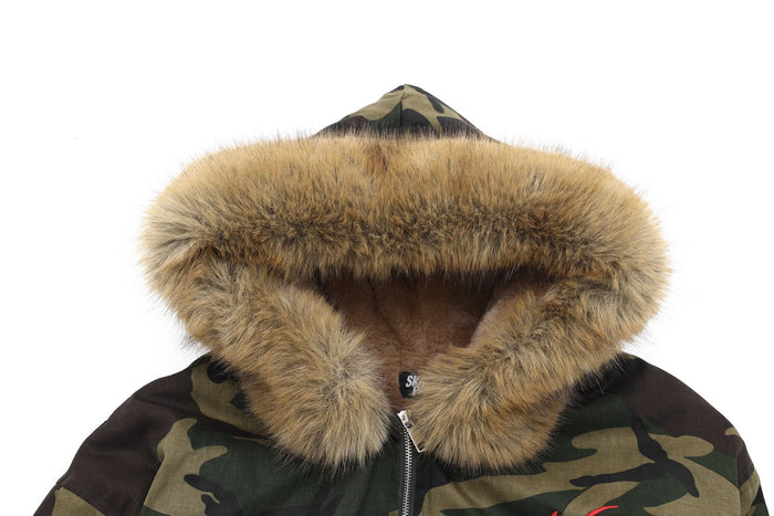 Close-up of faux-fur hood on camo bomber jacket with front zipper