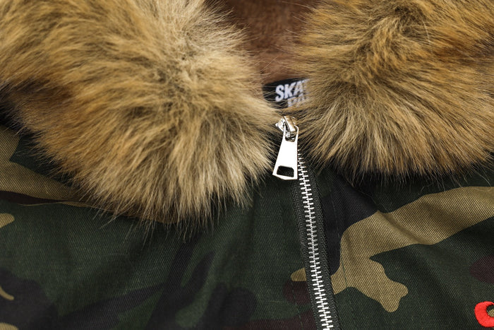 Close-up of faux-fur hood and silver zipper on camo bomber jacket