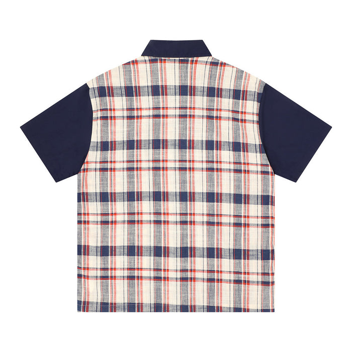 Back view of oversized plaid short sleeve shirt with navy sleeves and collar