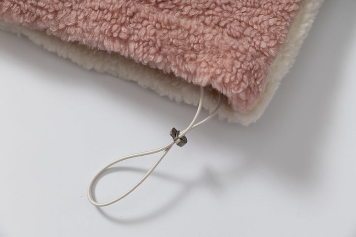 Pink sherpa fleece hem with cream drawcord loop and toggle detail