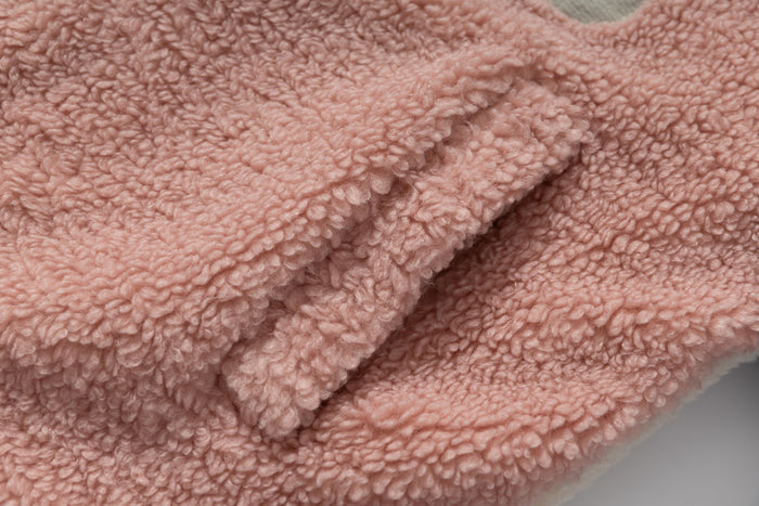 Close-up of pink sherpa fleece sleeve cuff