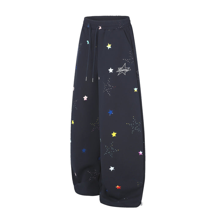 Black wide-leg sweatpants with multicolor star print, front view