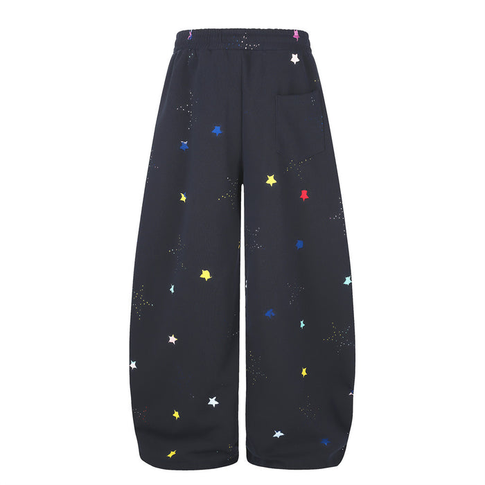 Black wide-leg sweatpants with multicolor star print, back view with patch pocket