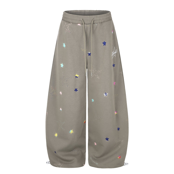 Taupe wide-leg sweatpants with multicolor star print, front view