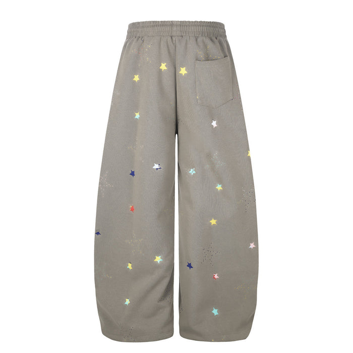 Taupe wide-leg sweatpants with multicolor star print, back view with patch pocket