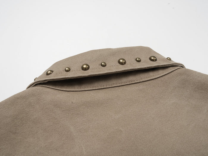 Close-up of studded collar on khaki cotton work jacket