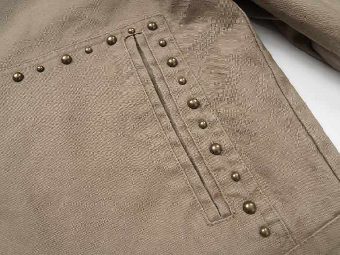Chest pocket with brass studs and vertical zip on khaki work jacket