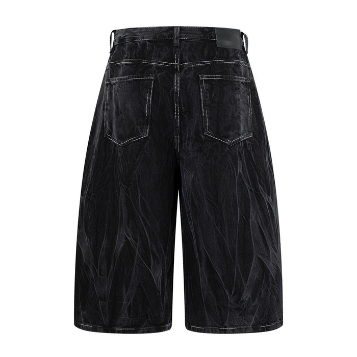 Black denim shorts back view with two patch pockets and a wide-leg fit