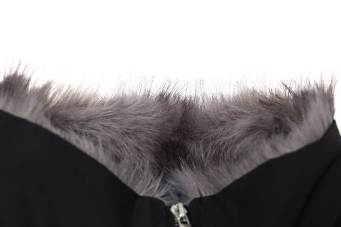 Close-up of gray fur collar on a black cropped bomber jacket