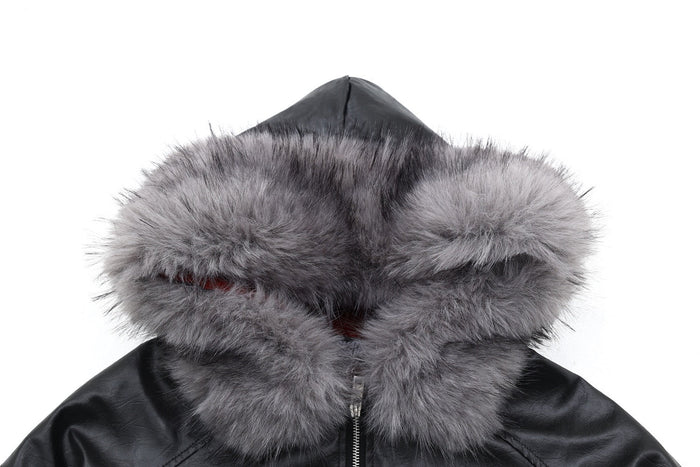 Close-up of black bomber jacket hood with thick gray faux-fur trim and visible front zipper