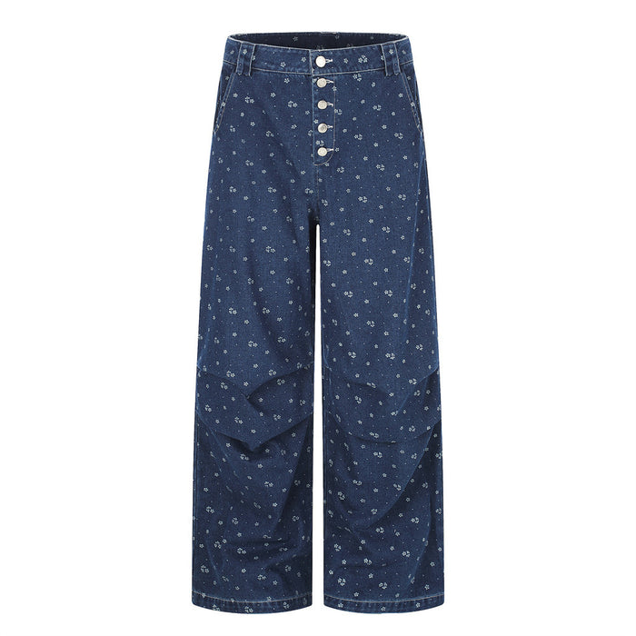 Front view of dark blue baggy jeans with floral print and five-button fly