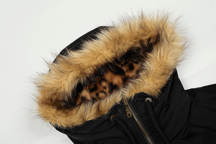 Close-up of hood with tan faux fur and leopard-print lining on black jacket