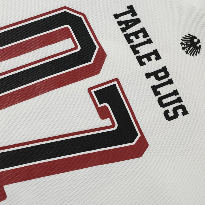 Close-up of white jersey front showing 07 print and TAELE PLUS text