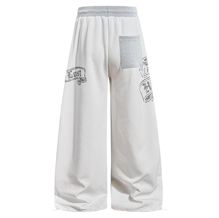 White wide-leg sweatpants with graphic prints, back view with patch pocket