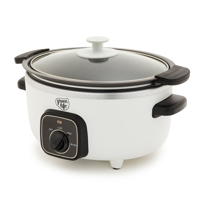 White slow cooker with black handles and control panel on a white background