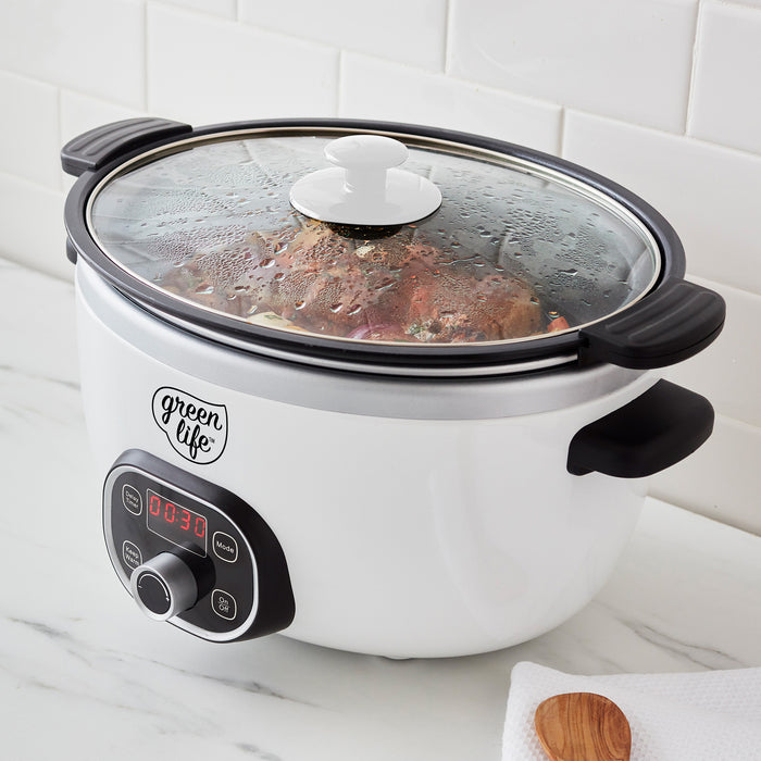 White slow cooker with digital display on a marble countertop