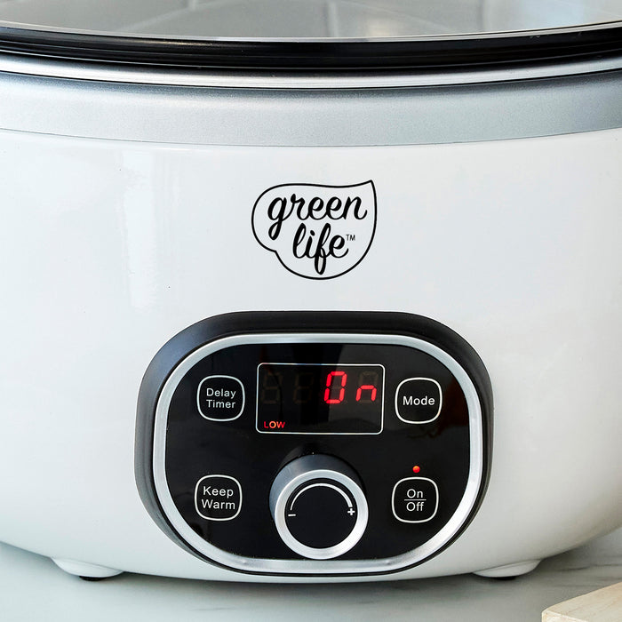 White slow cooker with 'greenlife' branding on a light background
