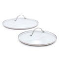 Two glass lids with stainless steel handles on a white background