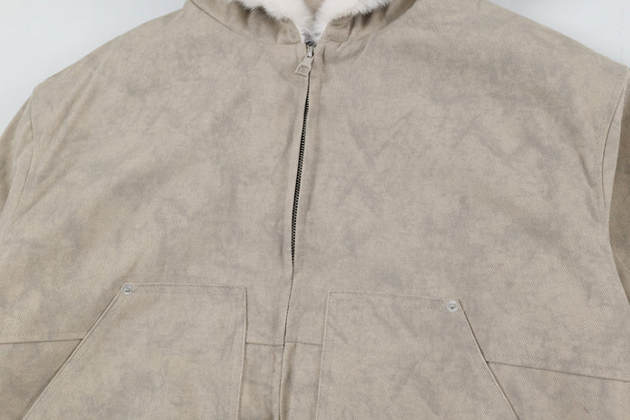Front chest view of beige bomber jacket with zipper and flap pockets