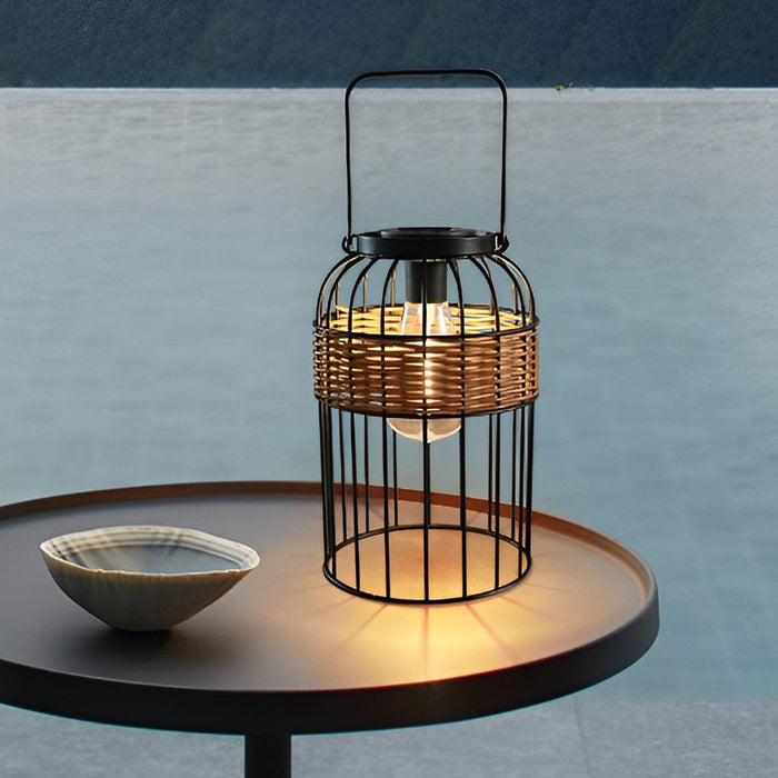 Handwoven Rattan Solar Outdoor Lantern Black Iron Portable Auto On Off IP55 Waterproof LED 6 Inch | NordaLight