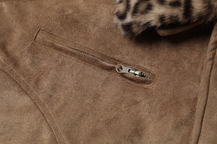 Close-up of front chest zipper pocket on brown suede bomber jacket