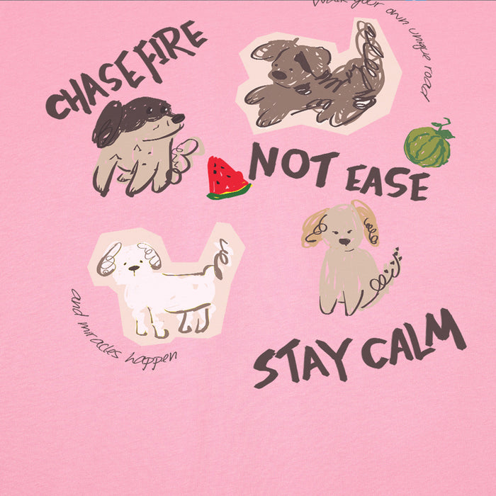 Close-up of light pink tee graphic showing cartoon dogs, watermelon and bold text