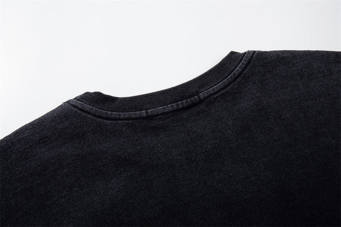 Close-up of the back neckline on a black long sleeve tee
