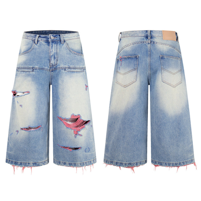 Washed blue distressed wide-leg denim shorts front and back views with pink thread