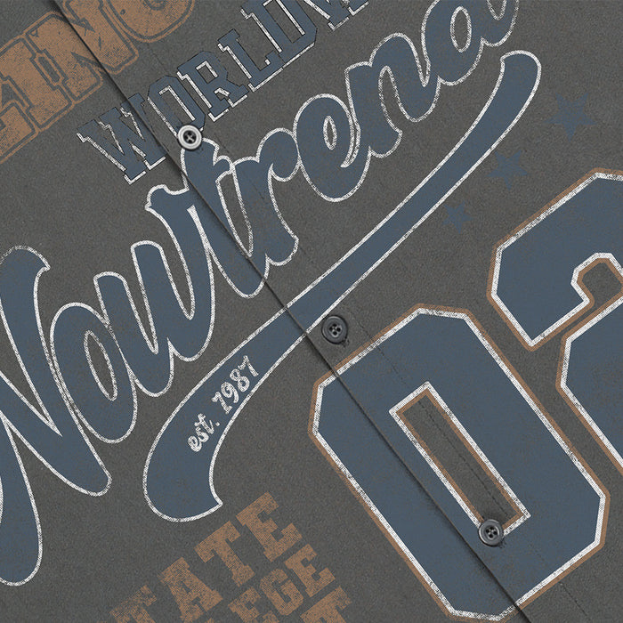 Close-up of varsity-style front graphic on dark gray button-down shirt