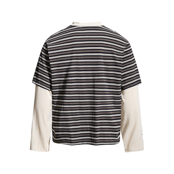 Black striped Henley t-shirt with cream long sleeves, back view