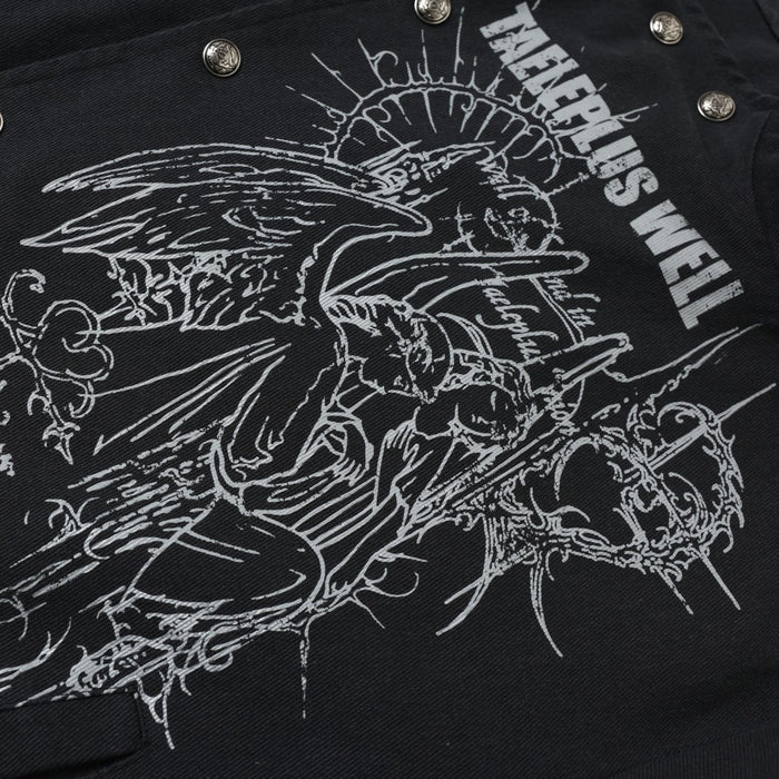 Close-up of black jacket chest showing angel graphic, metallic snaps, and distressed white print
