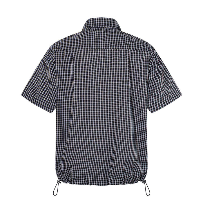 Black plaid short sleeve shirt, back view with adjustable drawstring hem