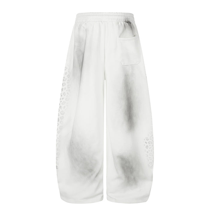 Back view of white wide leg sweatpants with tie-dye fade and rear pocket