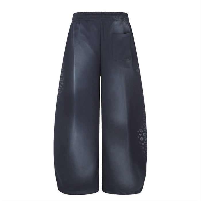 Back view of navy wide leg sweatpants with tie-dye fade and rear pocket