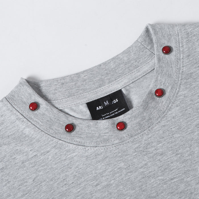 Gray punk graphic T-shirt with a red studded crew neckline and visible ARESWINGS label detail