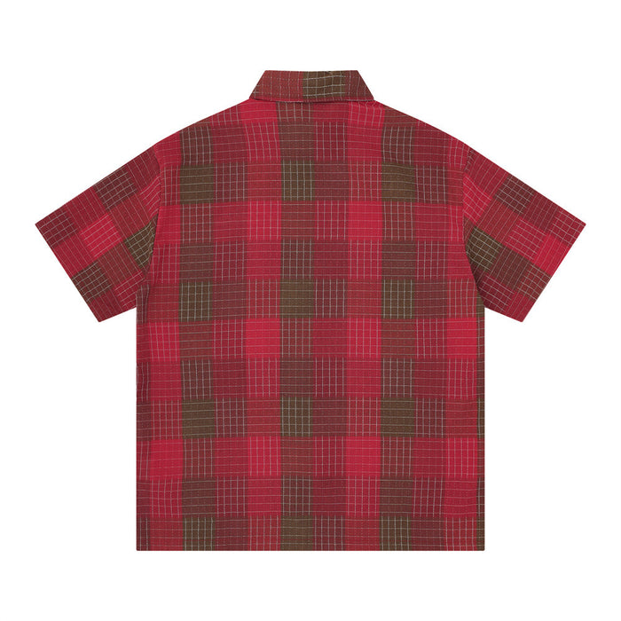 Red plaid short sleeve button-up shirt with oversized fit and mosaic check pattern on a white background